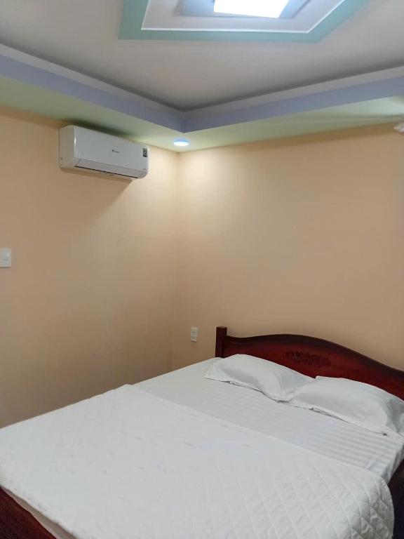 Postel nebo postele na pokoji v ubytování HOTEL MOTeL Đồng Khởi