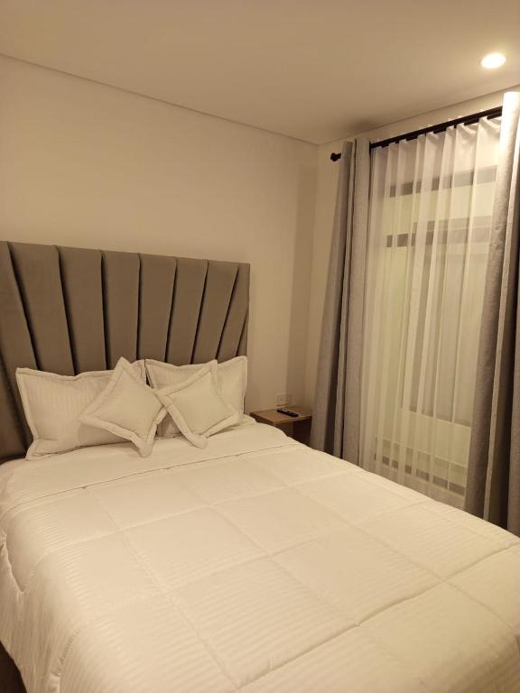 Postel nebo postele na pokoji v ubytování HOTEl SARÒN