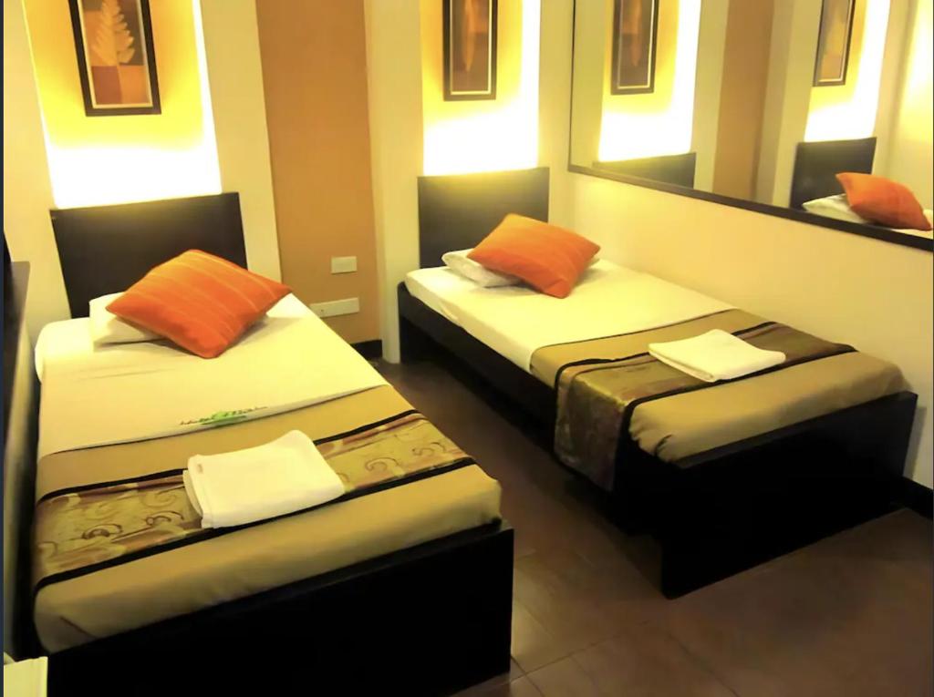 Postel nebo postele na pokoji v ubytování Hotel Mikka