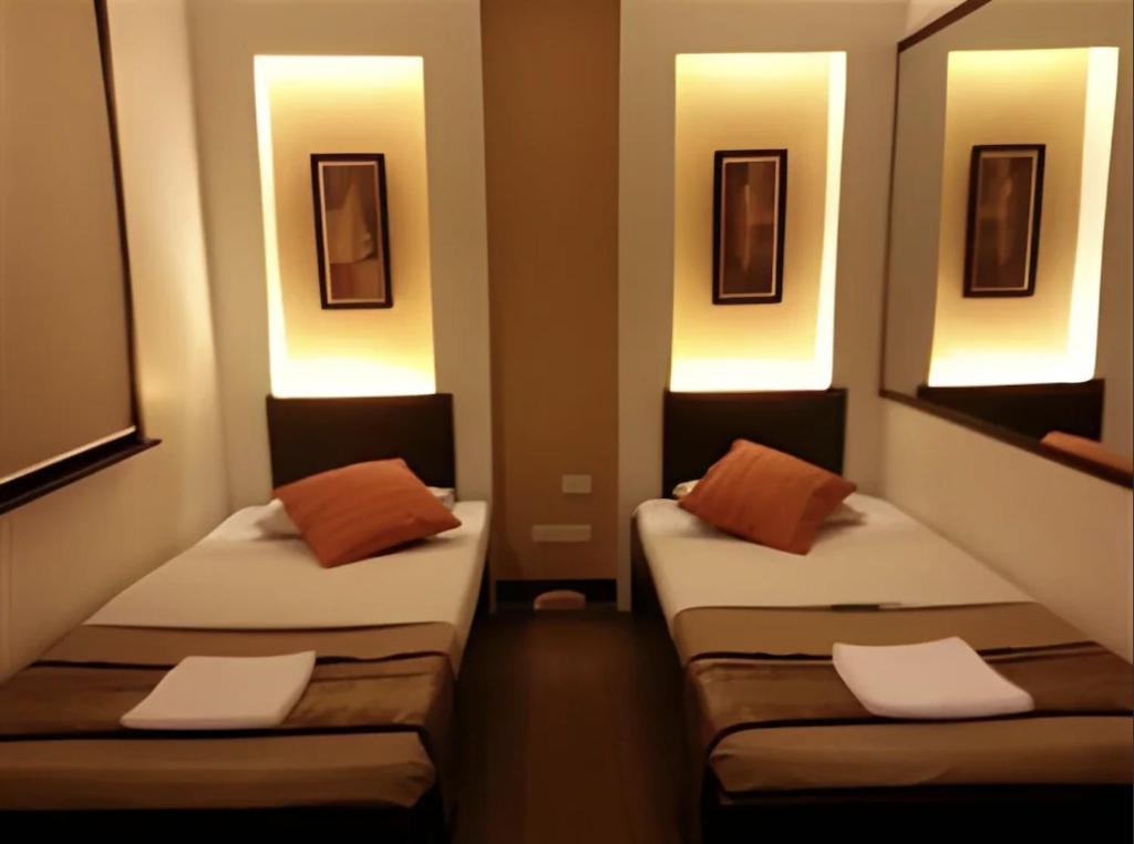 Postel nebo postele na pokoji v ubytování Hotel Mikka