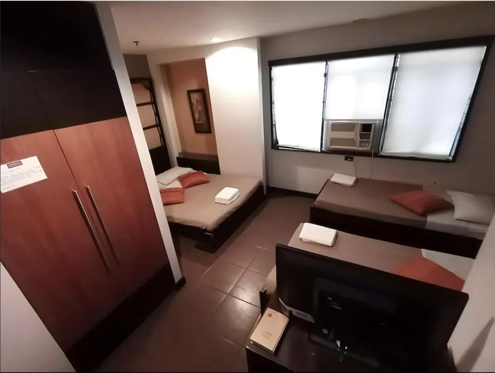 Postel nebo postele na pokoji v ubytování Hotel Mikka