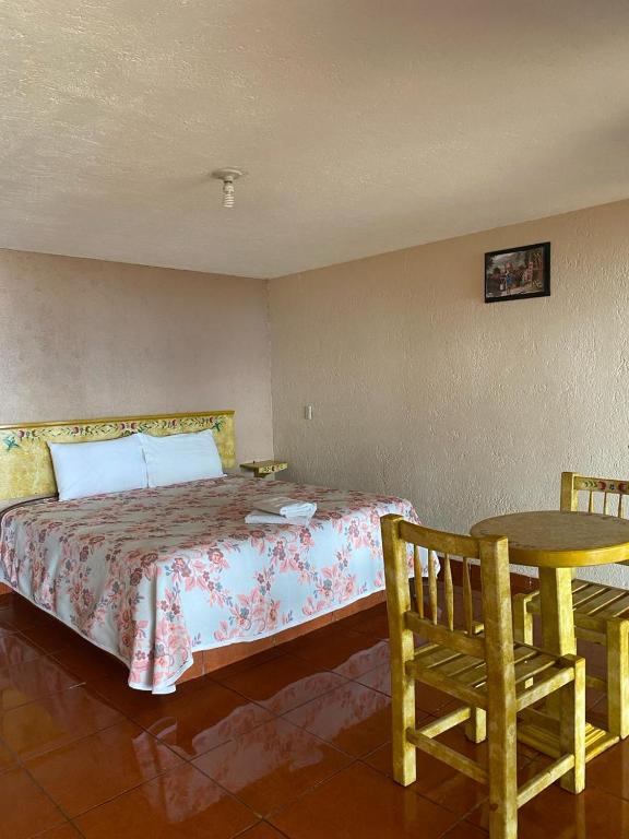 Postel nebo postele na pokoji v ubytování Cabañas y Habitaciones El Malecón
