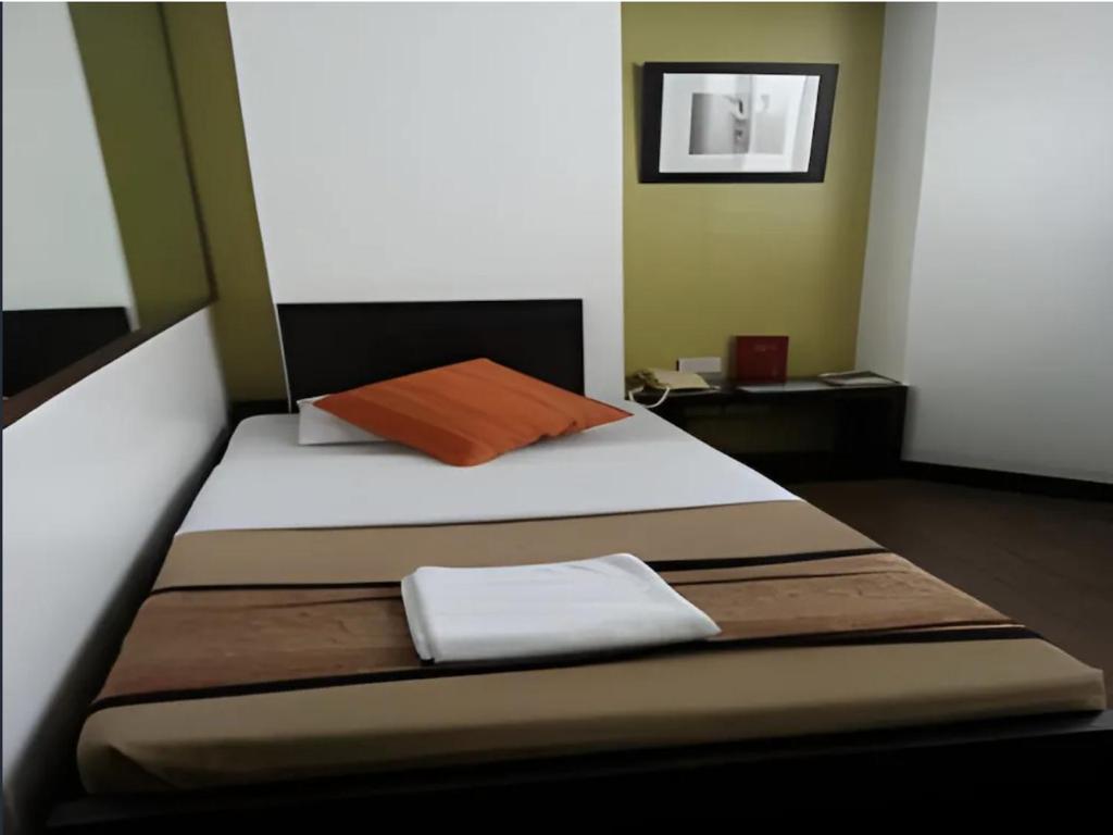 Postel nebo postele na pokoji v ubytování Hotel Mikka