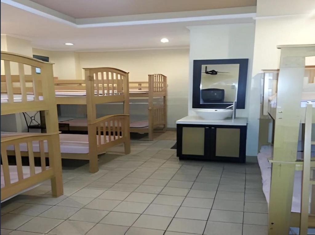 Postel nebo postele na pokoji v ubytování Hotel Mikka