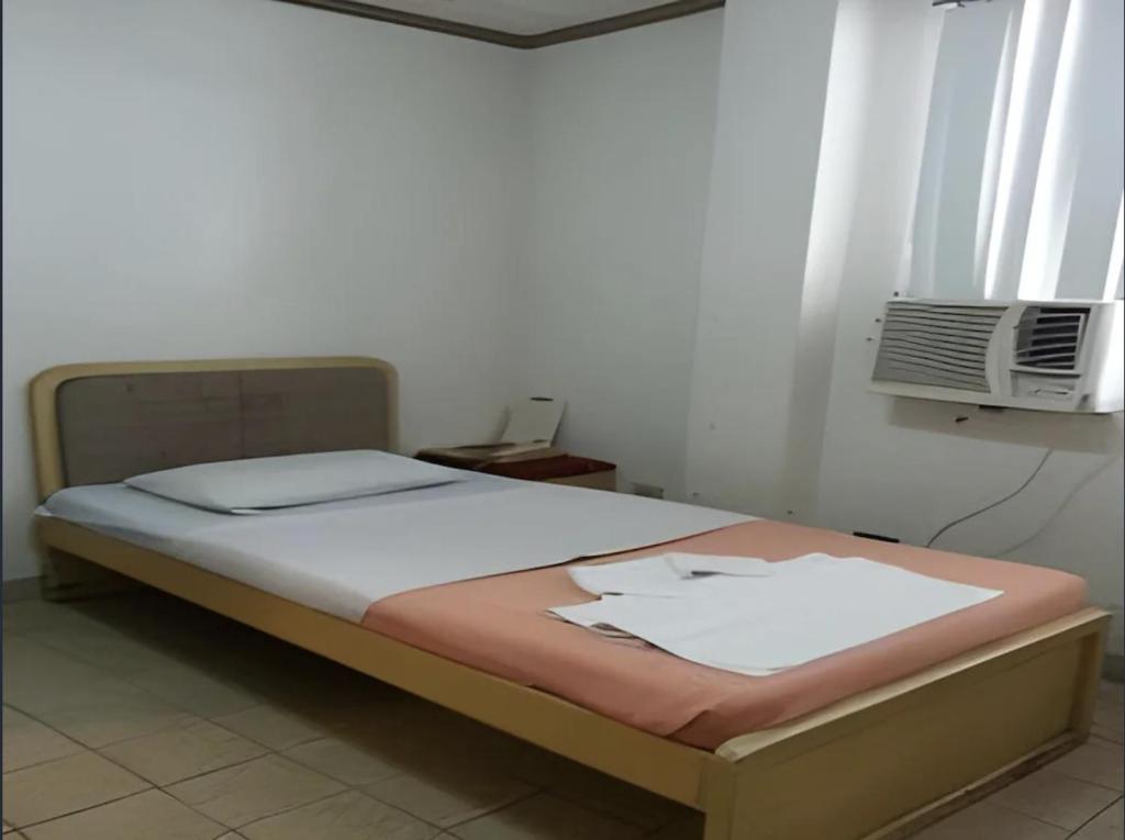 Postel nebo postele na pokoji v ubytování Hotel Mikka