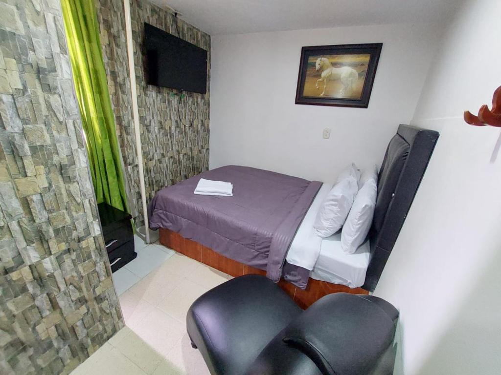 TV a/nebo společenská místnost v ubytování Hotel Punto 100