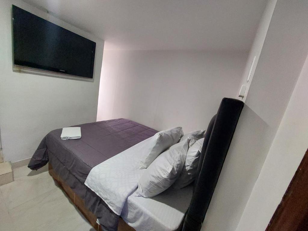 Postel nebo postele na pokoji v ubytování Hotel Punto 100