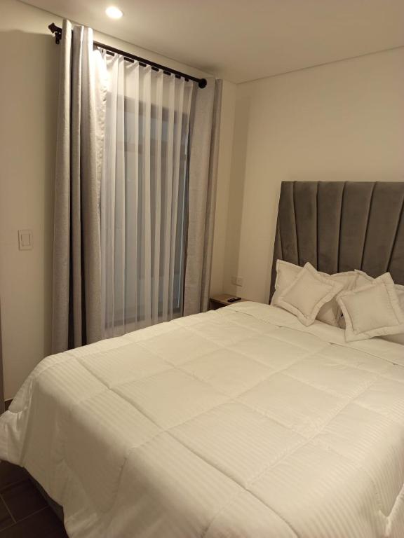 Postel nebo postele na pokoji v ubytování HOTEl SARÒN