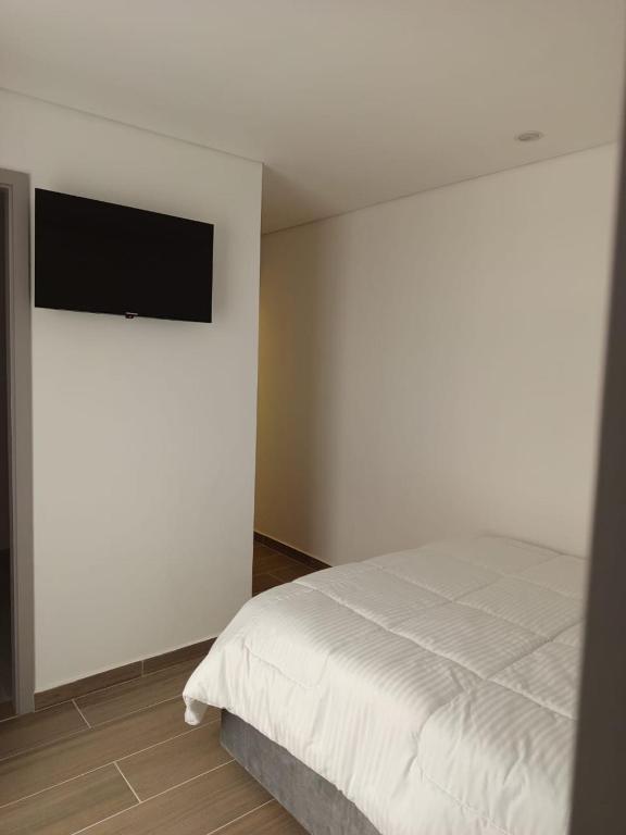 TV a/nebo společenská místnost v ubytování HOTEl SARÒN