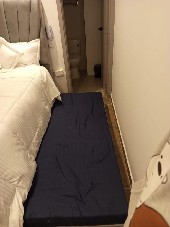 Postel nebo postele na pokoji v ubytování HOTEl SARÒN