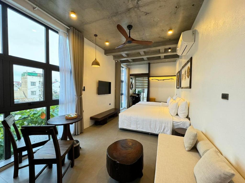 Postel nebo postele na pokoji v ubytování Eco & Rustic Home Hoian