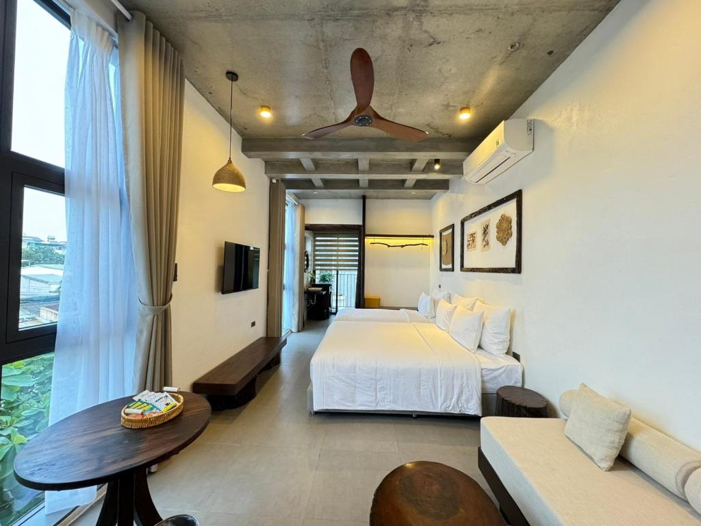Postel nebo postele na pokoji v ubytování Eco & Rustic Home Hoian
