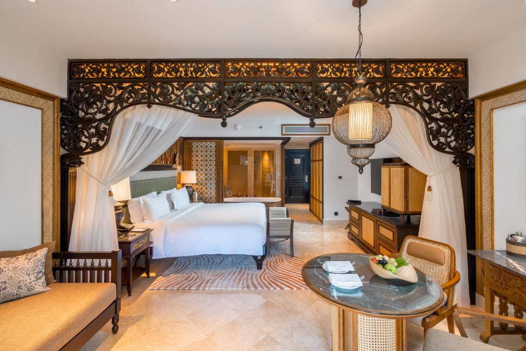 Postel nebo postele na pokoji v ubytování AYANA Resort Bali