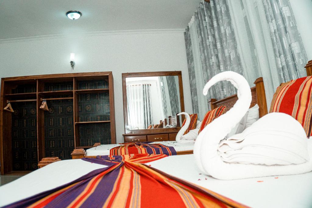 Postel nebo postele na pokoji v ubytování 64 ZENJ HOUSE Luxury AIRPORT HOTEL