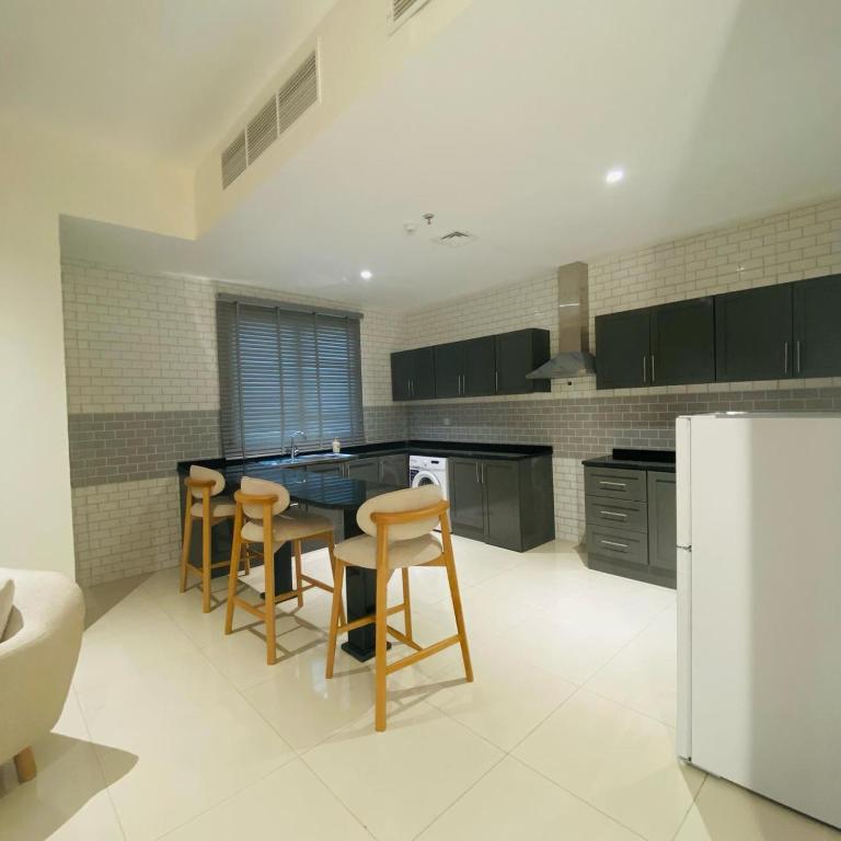 Kuchyň nebo kuchyňský kout v ubytování Baithans Hotel - Furnished Apartments