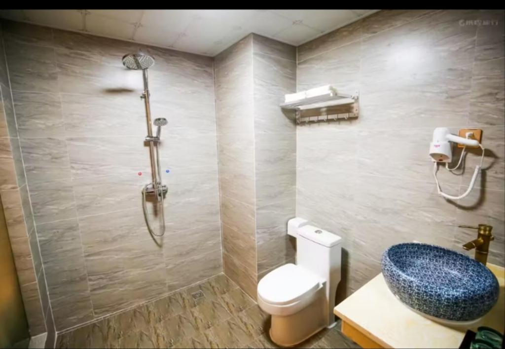 Koupelna v ubytování Louzhongxiaoge Inn
