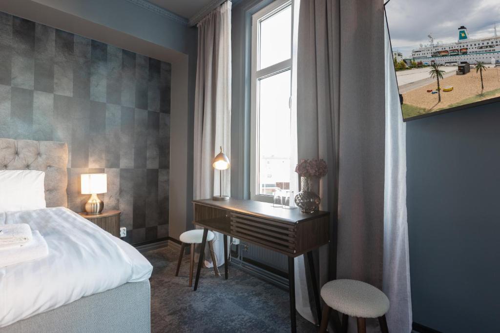 Postel nebo postele na pokoji v ubytování Hotell Drottninggatan 11