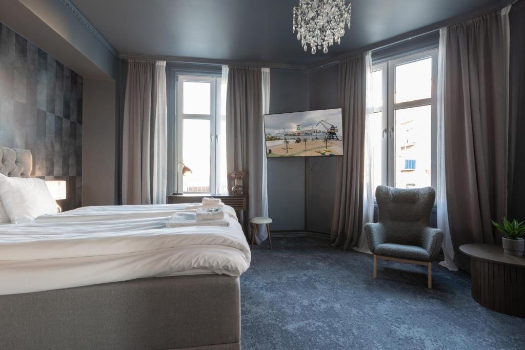 Postel nebo postele na pokoji v ubytování Hotell Drottninggatan 11