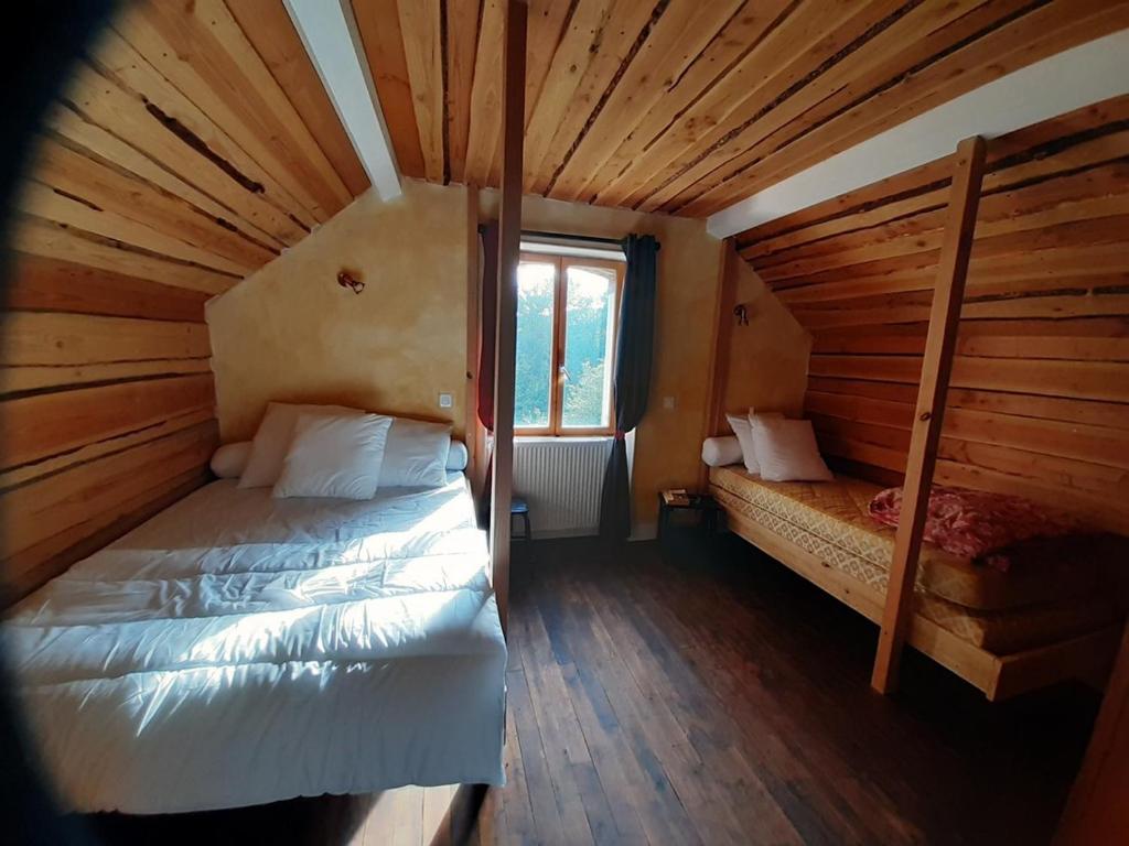 Postel nebo postele na pokoji v ubytování Grand gîte de groupe