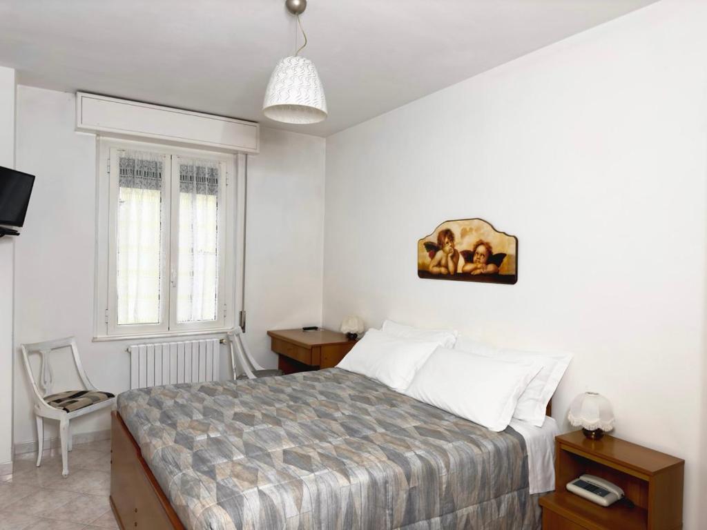 Łóżko lub łóżka w pokoju w obiekcie Albergo Edera