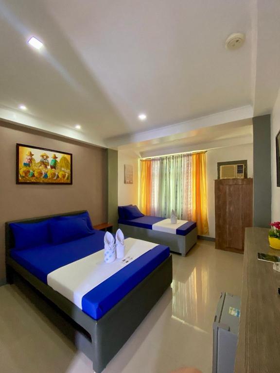 Postel nebo postele na pokoji v ubytování Elena's Suite El Nido