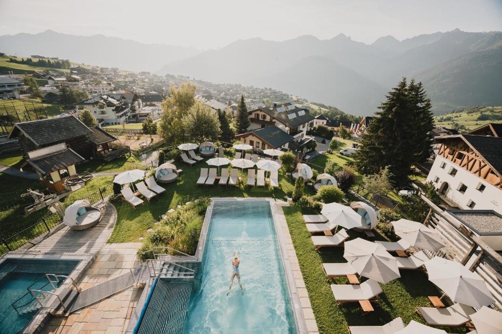 an overhead view of a swimming pool in a resort at Schlosshotel Fiss in Fiss