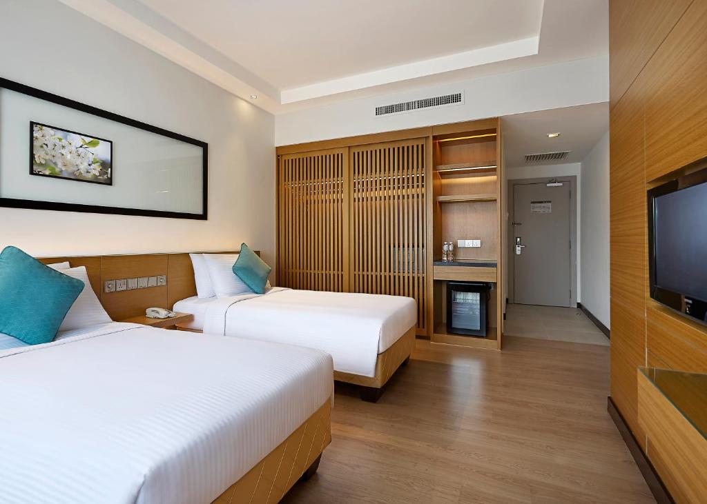 Postel nebo postele na pokoji v ubytování ANSA Hotel Kuala Lumpur