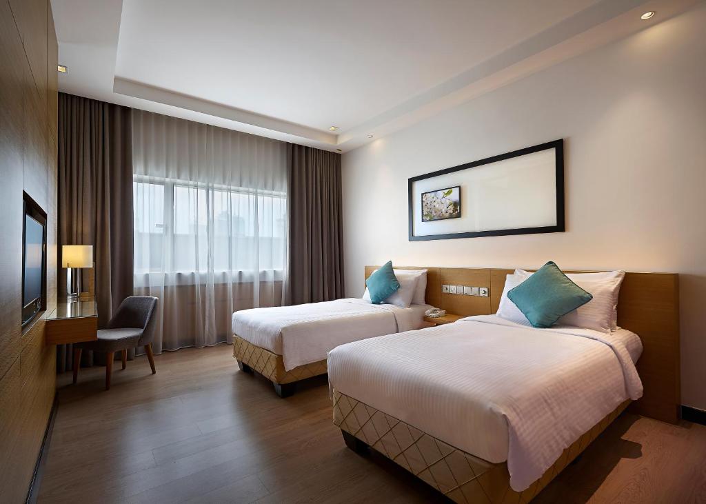 Postel nebo postele na pokoji v ubytování ANSA Hotel Kuala Lumpur