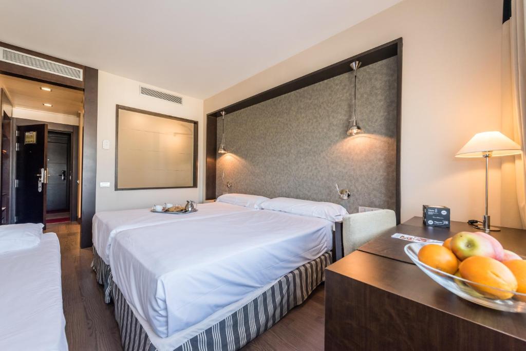 Cama o camas de una habitación en Hotel Mercader