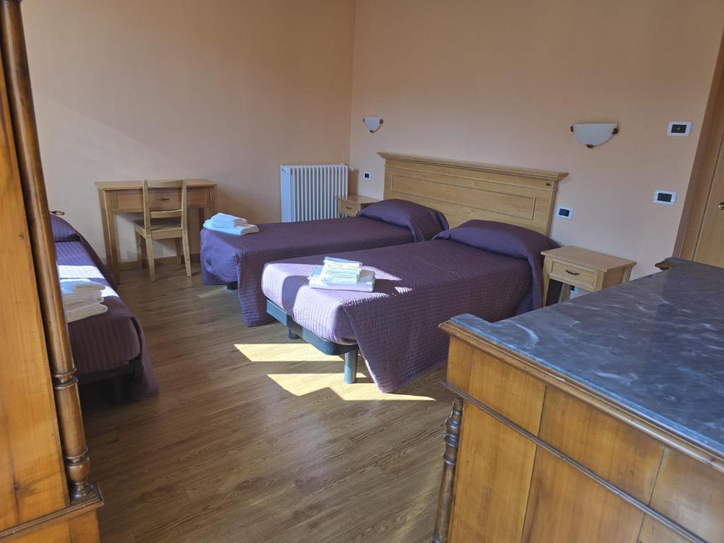 Postel nebo postele na pokoji v ubytování Albergo Minetto