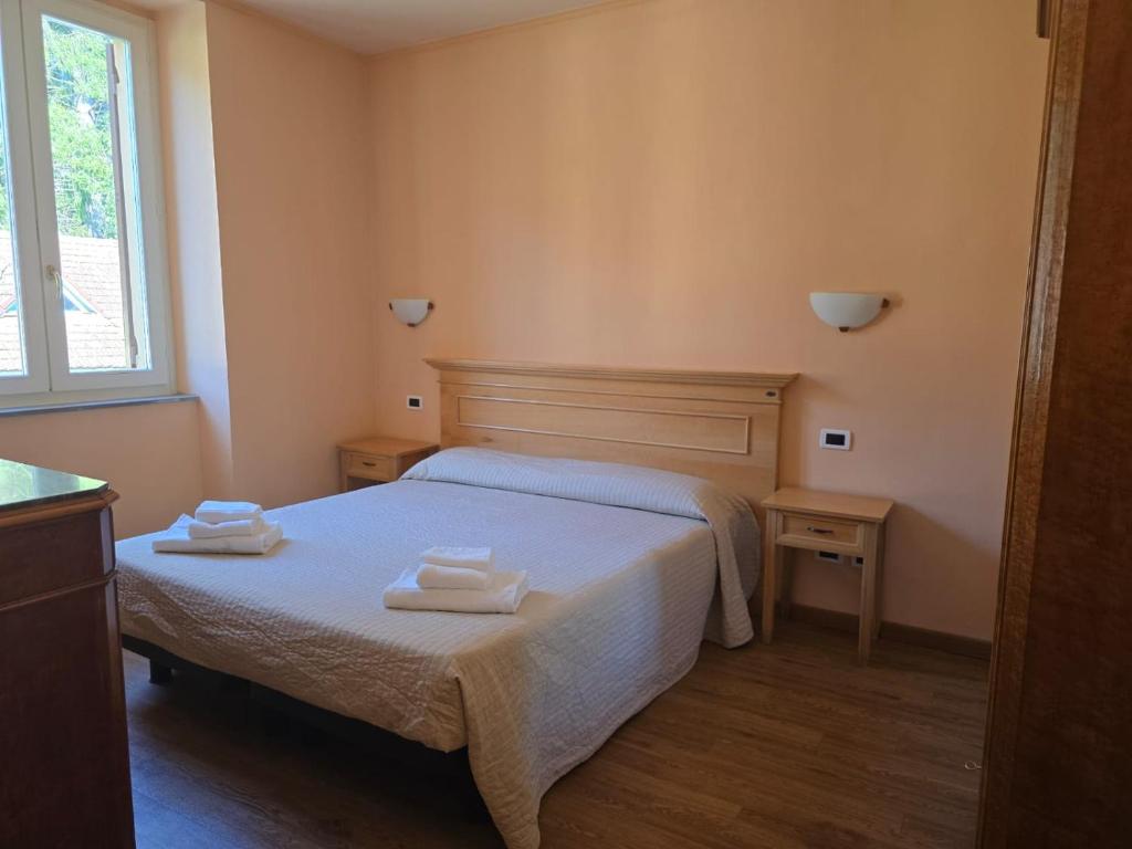 Postel nebo postele na pokoji v ubytování Albergo Minetto
