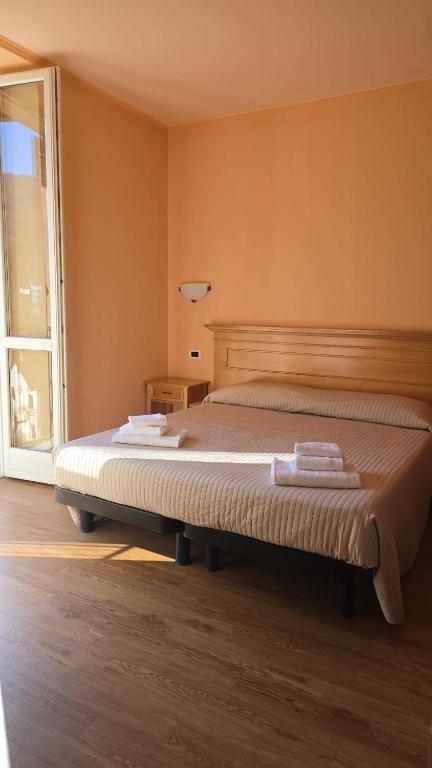 Postel nebo postele na pokoji v ubytování Albergo Minetto