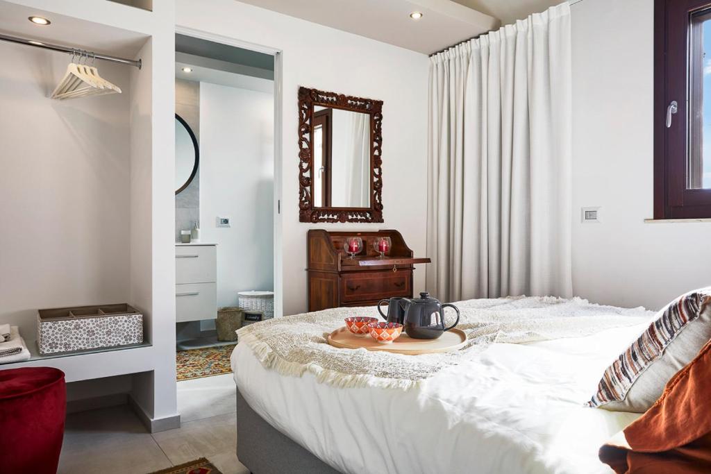 Łóżko lub łóżka w pokoju w obiekcie Villa Scarlet con piscina privata