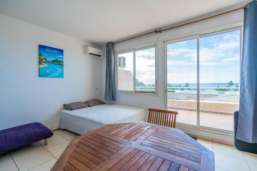 Postel nebo postele na pokoji v ubytování Diva Ocean Cosy Studio in Faaa