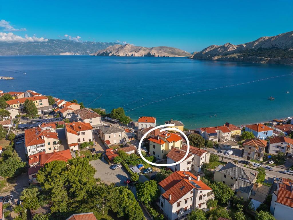 an aerial view of a town next to a body of water at Studio Apartments Cavrak with Terrace in Baška