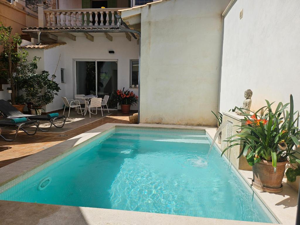 a swimming pool in the backyard of a house at S'Arcada Mallorca in Sa Pobla