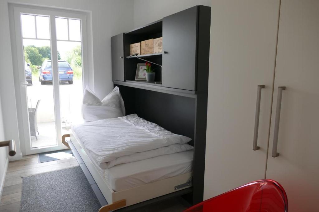 Postel nebo postele na pokoji v ubytování Come In Haffkrug