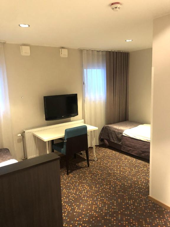 TV a/nebo společenská místnost v ubytování Finn Apartments