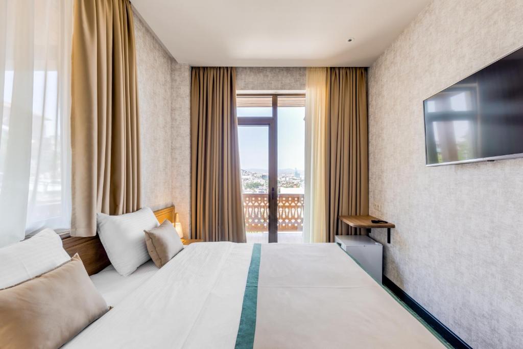 Postel nebo postele na pokoji v ubytování Sole Palace