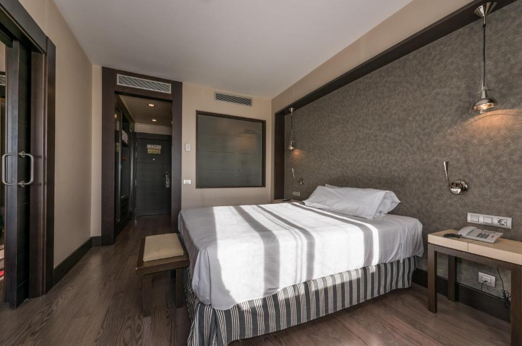 Cama o camas de una habitación en Hotel Mercader