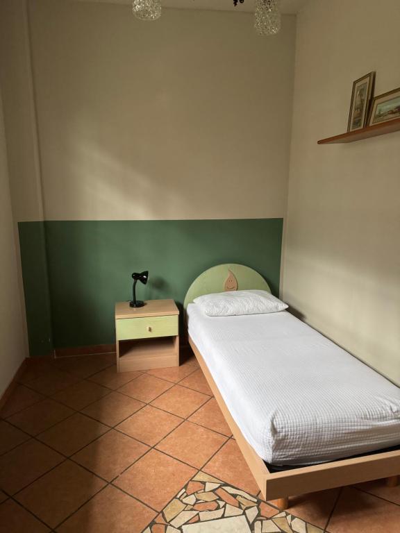 Postel nebo postele na pokoji v ubytování L’ulivo