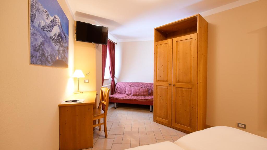 Postel nebo postele na pokoji v ubytování Albergo Ristoro Sitten - 2300 mt