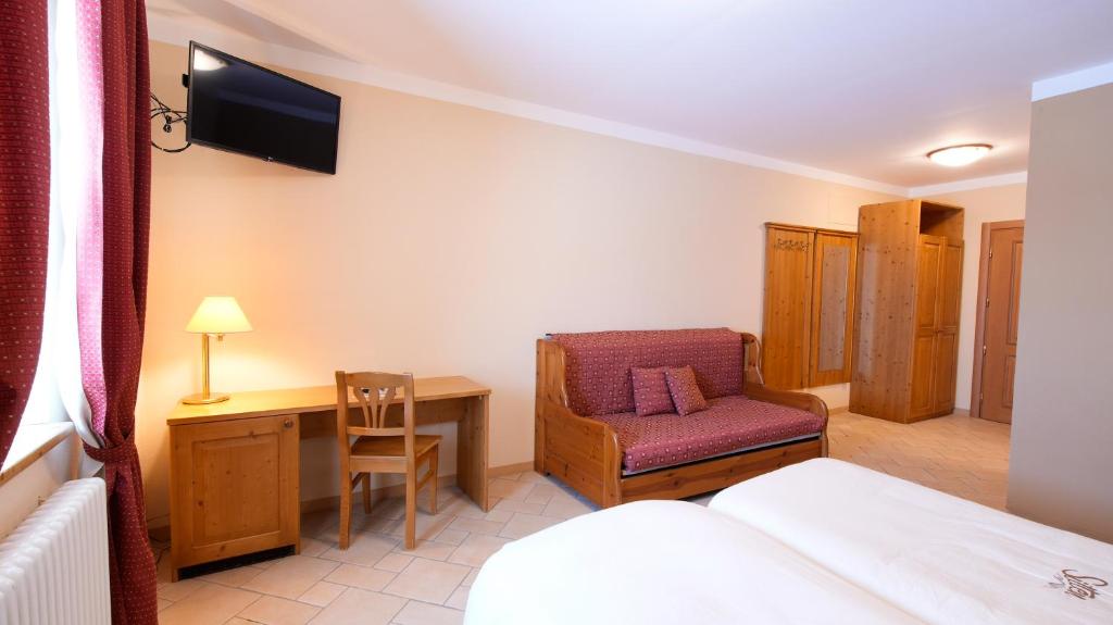 Postel nebo postele na pokoji v ubytování Albergo Ristoro Sitten - 2300 mt