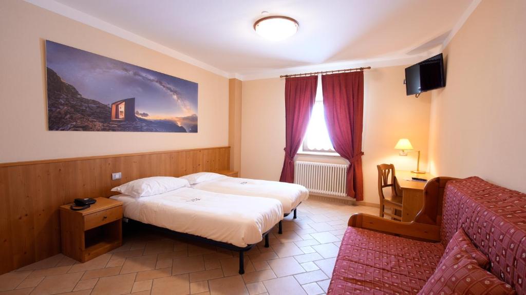 TV a/nebo společenská místnost v ubytování Albergo Ristoro Sitten - 2300 mt