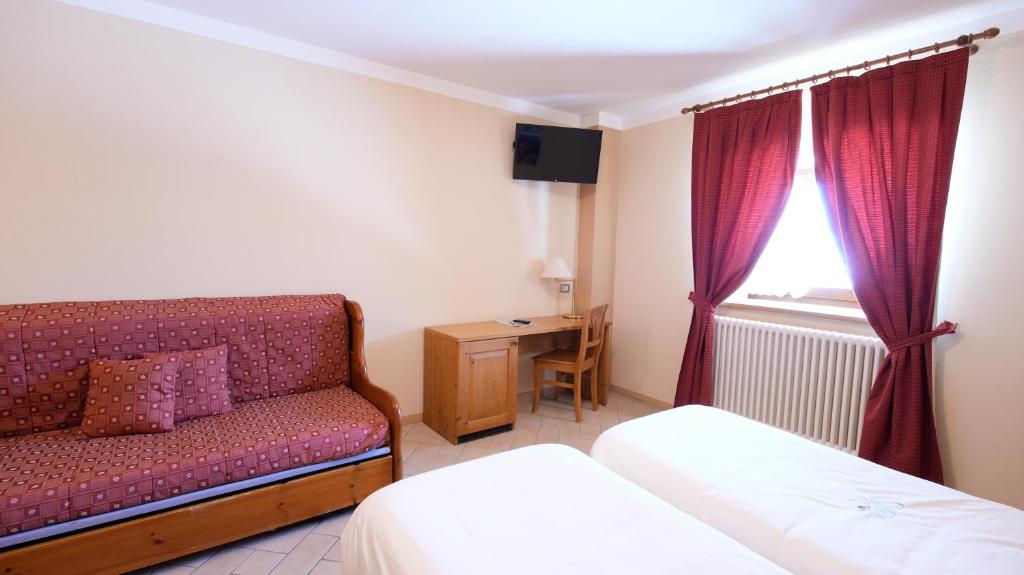 Postel nebo postele na pokoji v ubytování Albergo Ristoro Sitten - 2300 mt