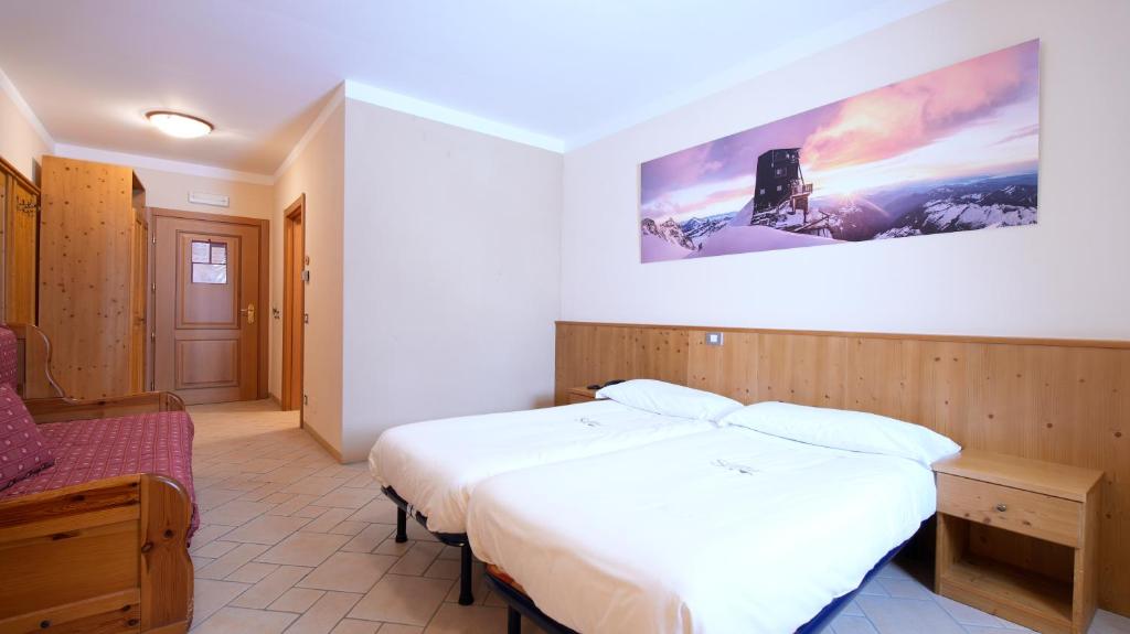 Postel nebo postele na pokoji v ubytování Albergo Ristoro Sitten - 2300 mt