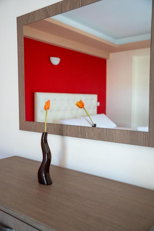 Postel nebo postele na pokoji v ubytování Coralli Hotel