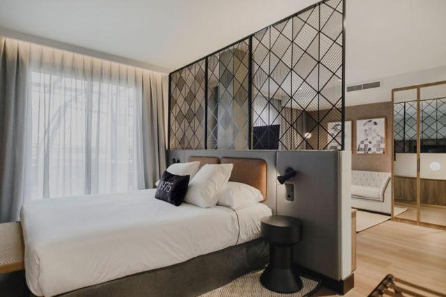 Postel nebo postele na pokoji v ubytování Hotel Dimar