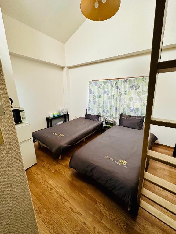 Postel nebo postele na pokoji v ubytování JOJO TC house