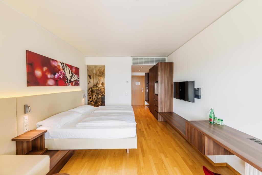 Posteľ alebo postele v izbe v ubytovaní Thermenhotel Karawankenhof